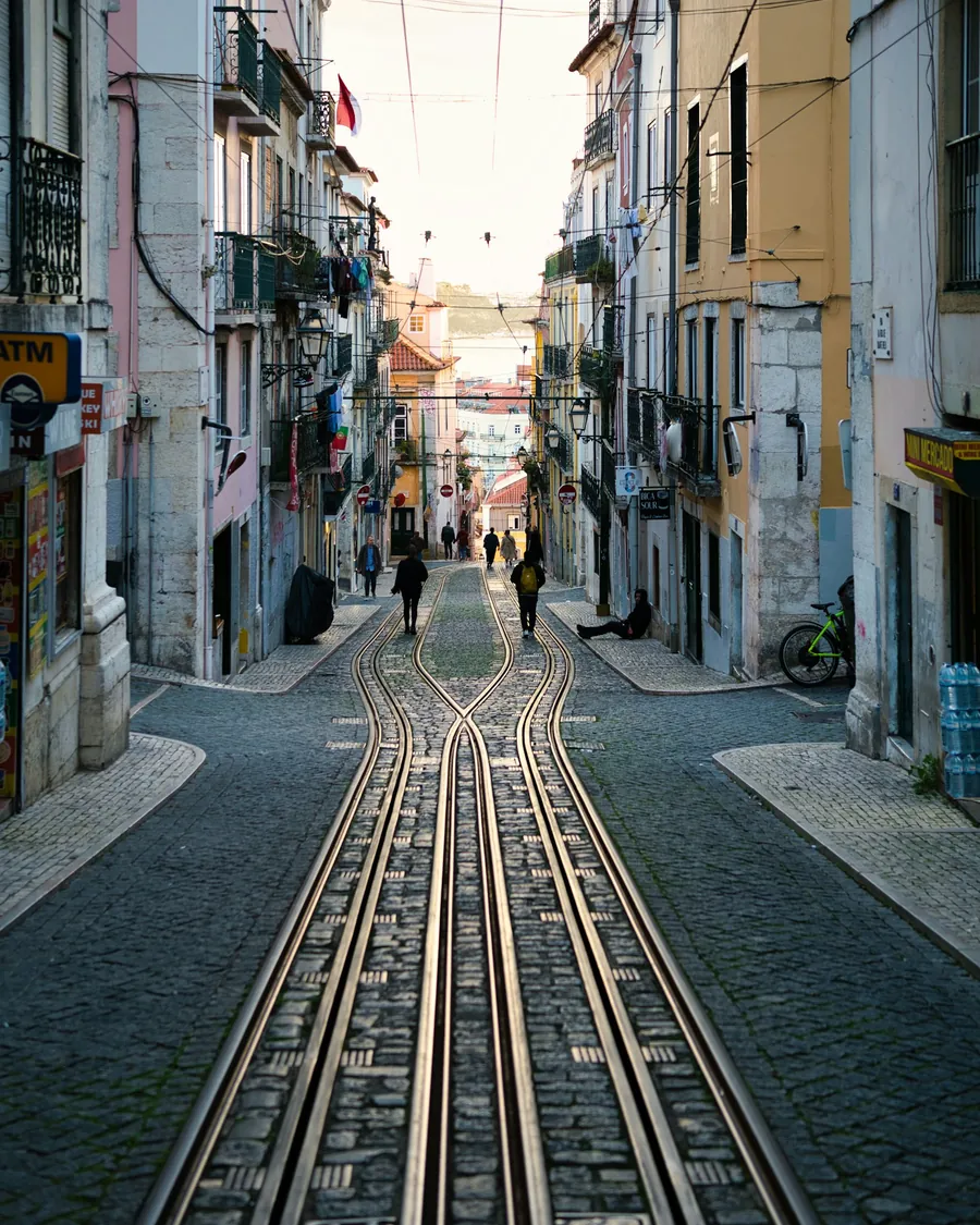 A quiet Lisbon street with tram lines
